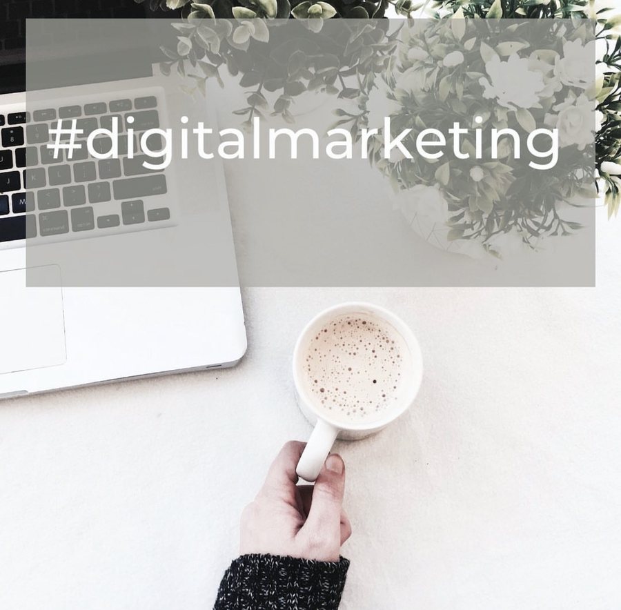 Hashtag digital marketing post over a coffee and laptop photograph