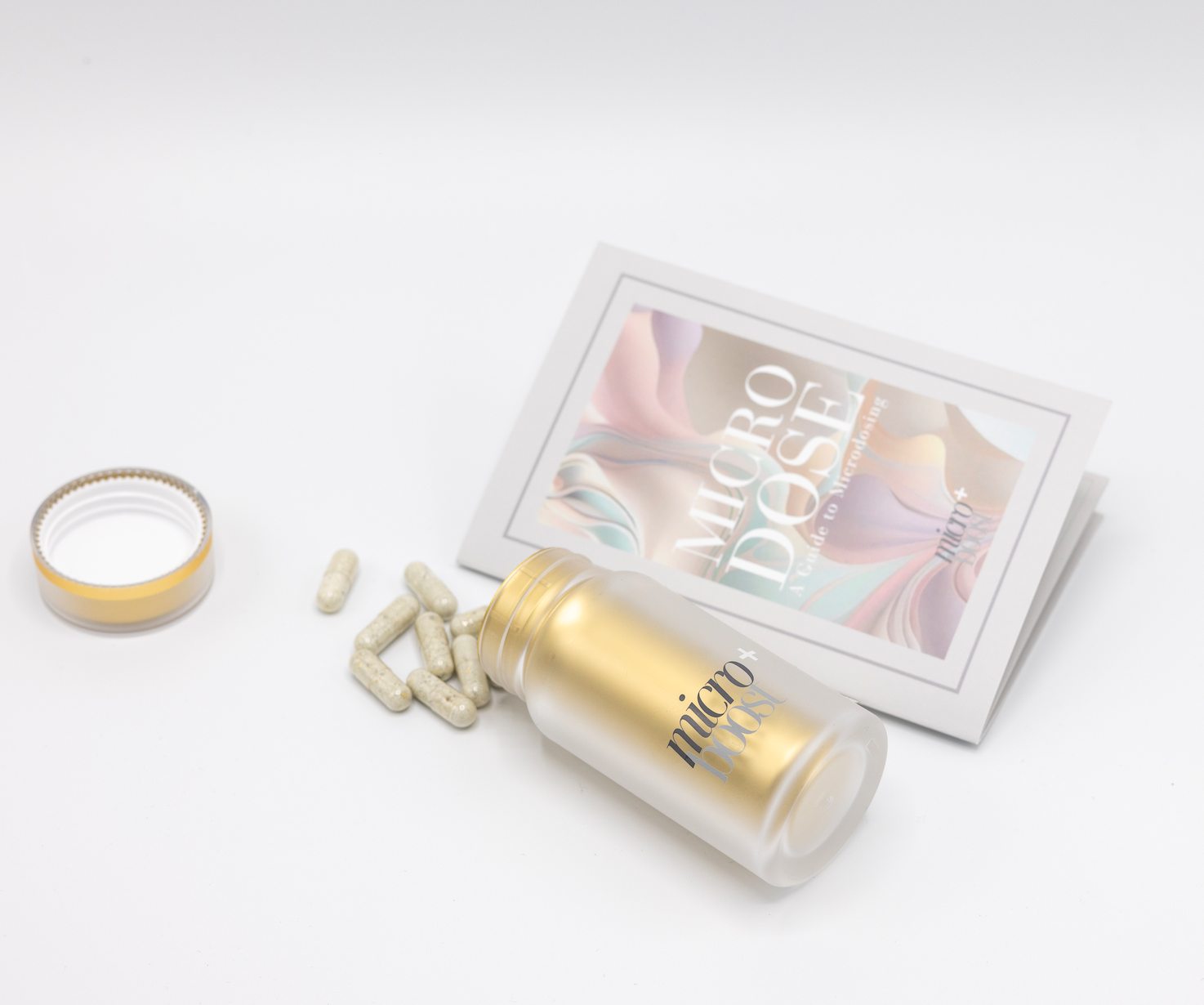 The bottle opened with capsules and the guide propped behind